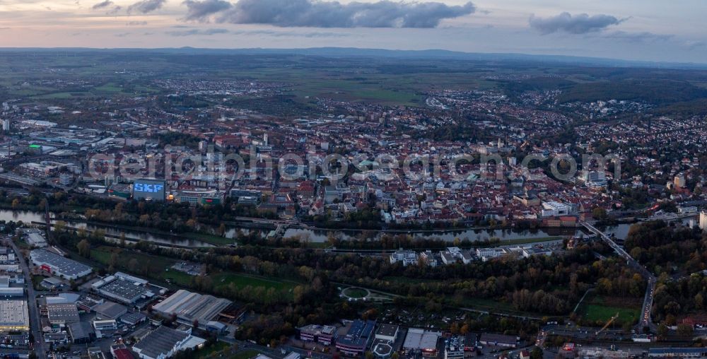 Schweinfurt from the bird's eye view: Evening City view on the river bank of the Main river in Schweinfurt in the state Bavaria, Germany
