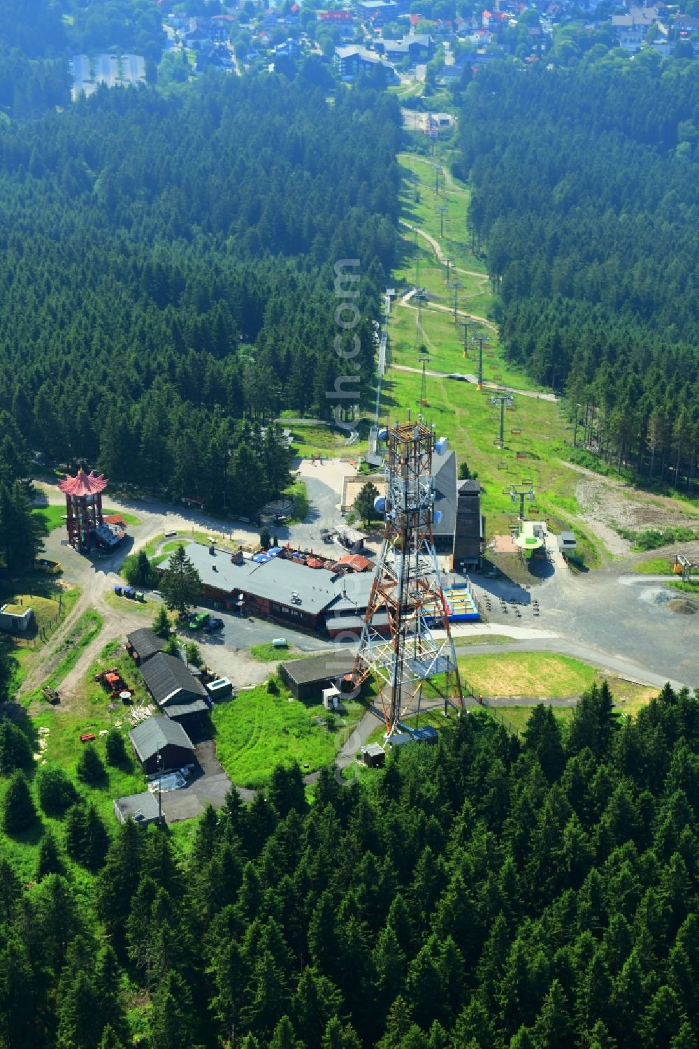 Aerial image Hahnenklee - Mountain slope with downhill ski slope and cable car - lift on Bocksberg in Hahnenklee in the state Lower Saxony, Germany