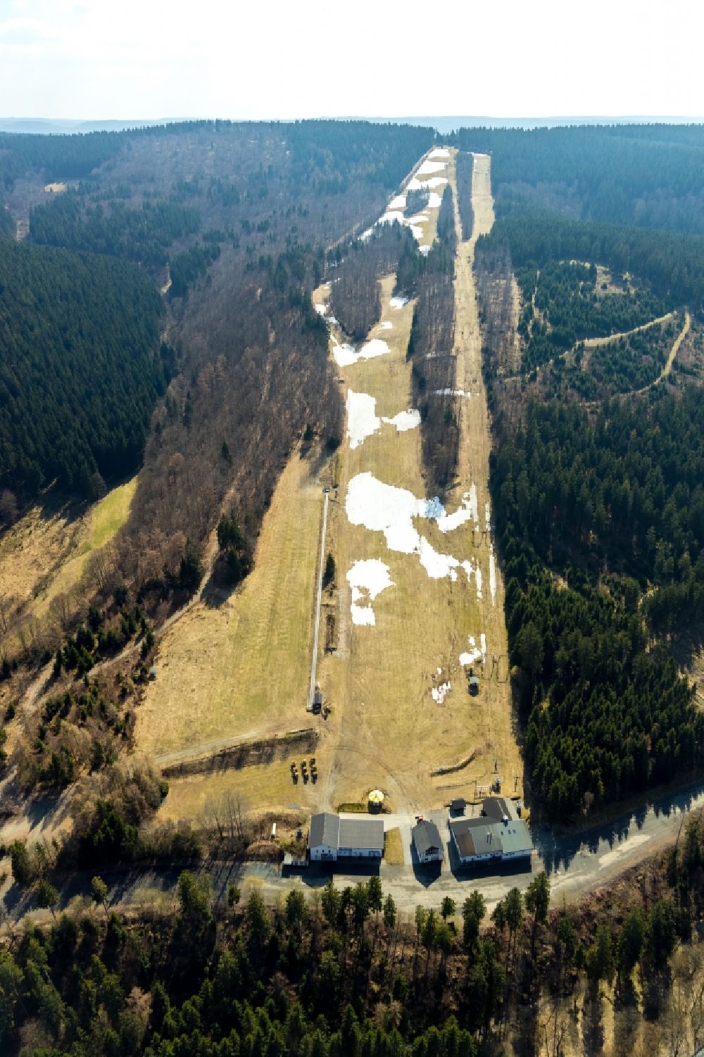 Aerial image Schmallenberg - Mountain slope with downhill ski slope and cable car - lift Hunaulift in Schmallenberg in the state North Rhine-Westphalia, Germany