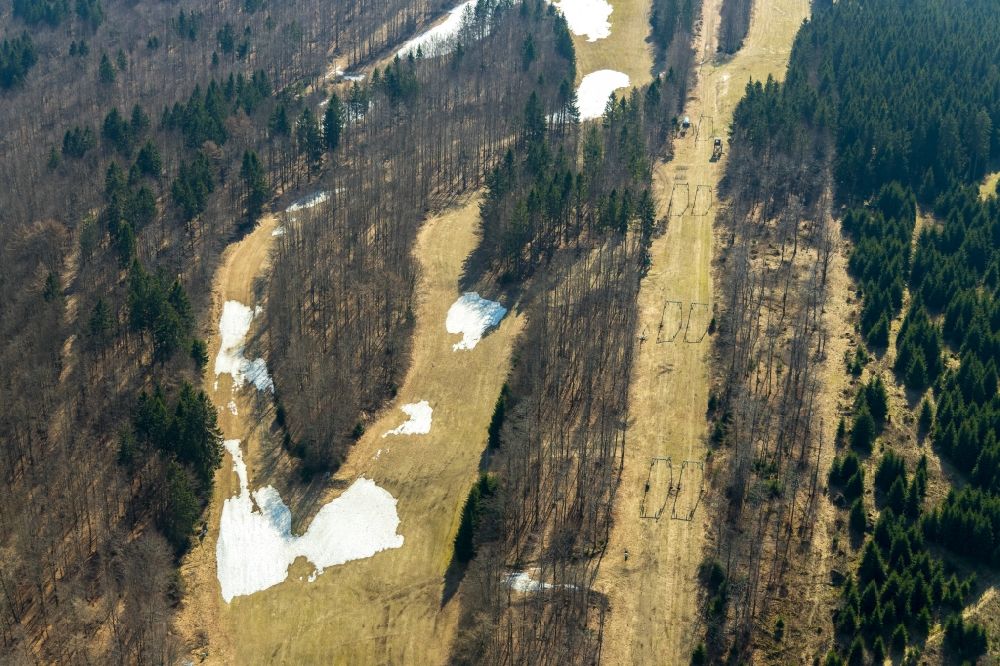 Aerial photograph Schmallenberg - Mountain slope with downhill ski slope and cable car - lift Hunaulift in Schmallenberg in the state North Rhine-Westphalia, Germany