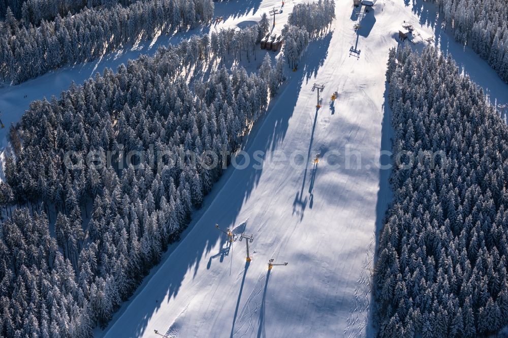 Aerial photograph Winterberg - Mountain slope with downhill ski slope and cable car - lift in Winterberg on Sauerland in the state North Rhine-Westphalia, Germany