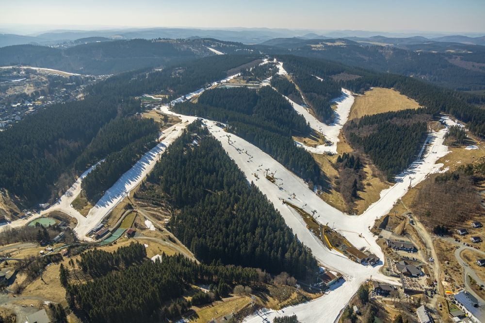 Winterberg from above - Mountain slope with downhill ski slope and cable car - lift in Winterberg on Sauerland in the state North Rhine-Westphalia, Germany