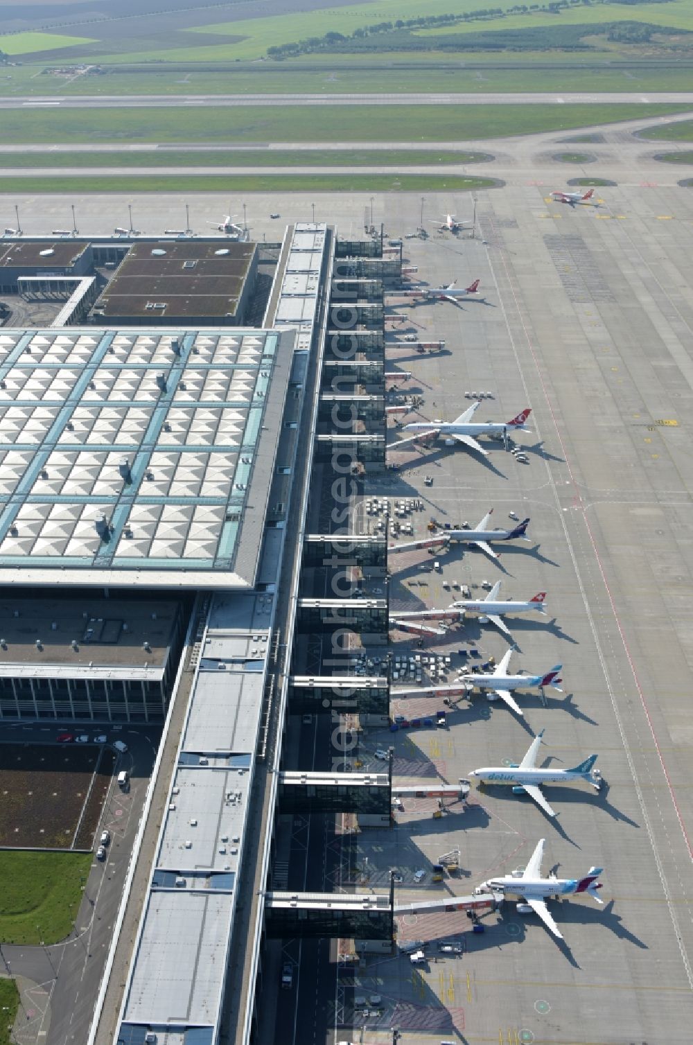 Schönefeld from the bird's eye view: Handling building and Terminals 1 on the grounds of Berlin Brandenburg Willy Brandt Airport, an international commercial airport in Schoenefeld in the federal state of Brandenburg, Germany