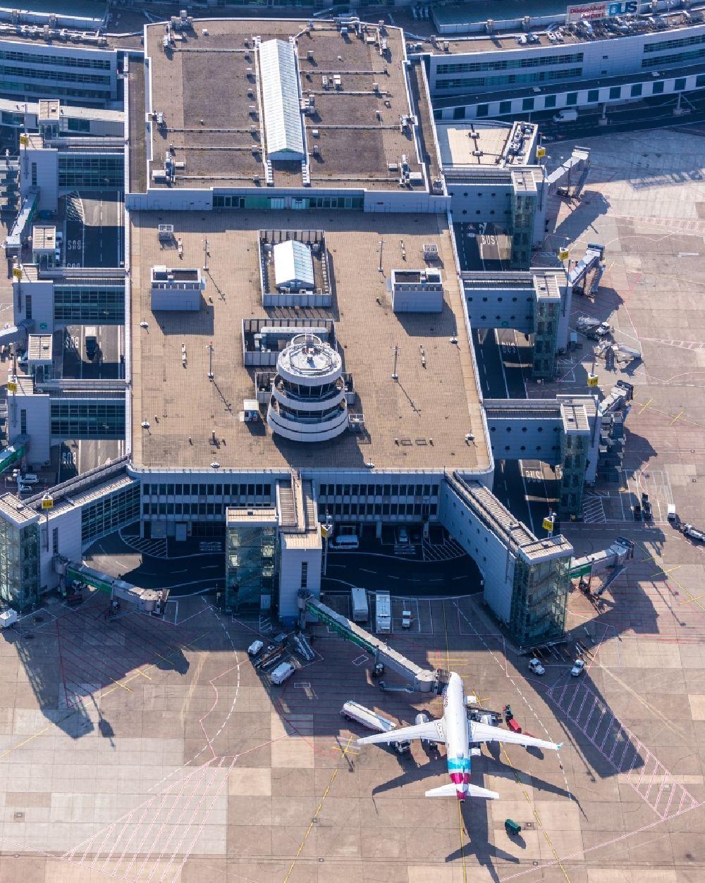 Düsseldorf from the bird's eye view: Dispatch building and terminals on the premises of the airport in Duesseldorf in the state North Rhine-Westphalia, Germany