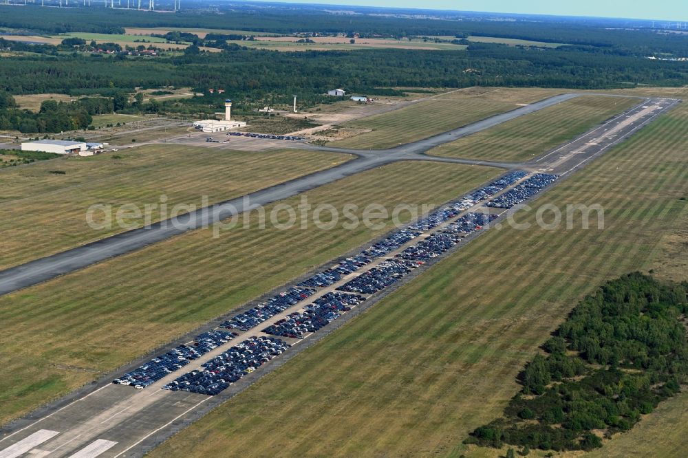 Parchim from the bird's eye view: Cars parked on the runway of the airport in Parchim in the state Mecklenburg-Western Pomerania, Germany