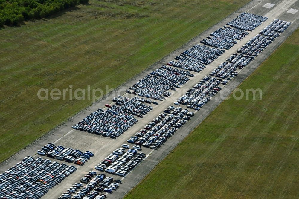 Parchim from the bird's eye view: Cars parked on the runway of the airport in Parchim in the state Mecklenburg-Western Pomerania, Germany