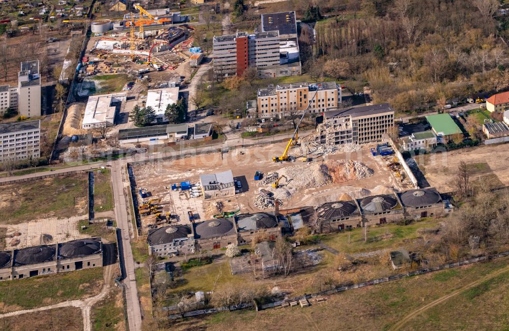 Berlin from the bird's eye view: Demolition and clearing work on the building complex of the former military barracks for property development for the new building project of the garden city on Koepenicker Allee - Am Alten Flugplatz in the district Karlshorst in Berlin, Germany