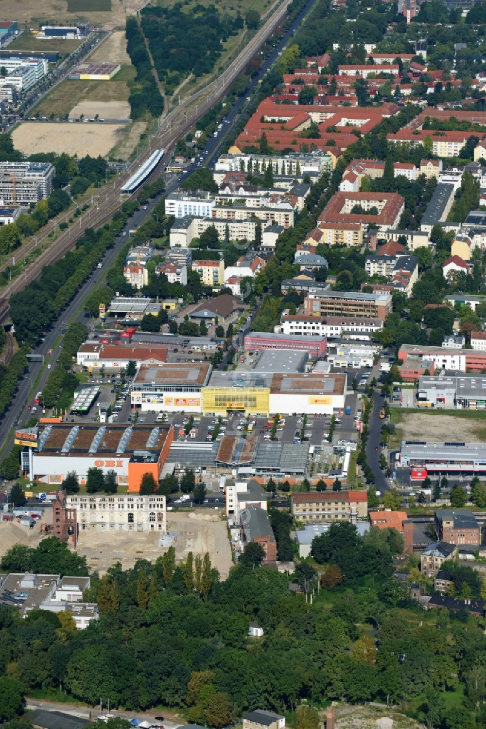 Aerial photograph Berlin - Demolition site of the ruins of the factory building of the former BaerenSiegel distillery on Adlergestell in Adlershof, Berlin. At the construction site of the distinctive production building GDR times development a shopping center