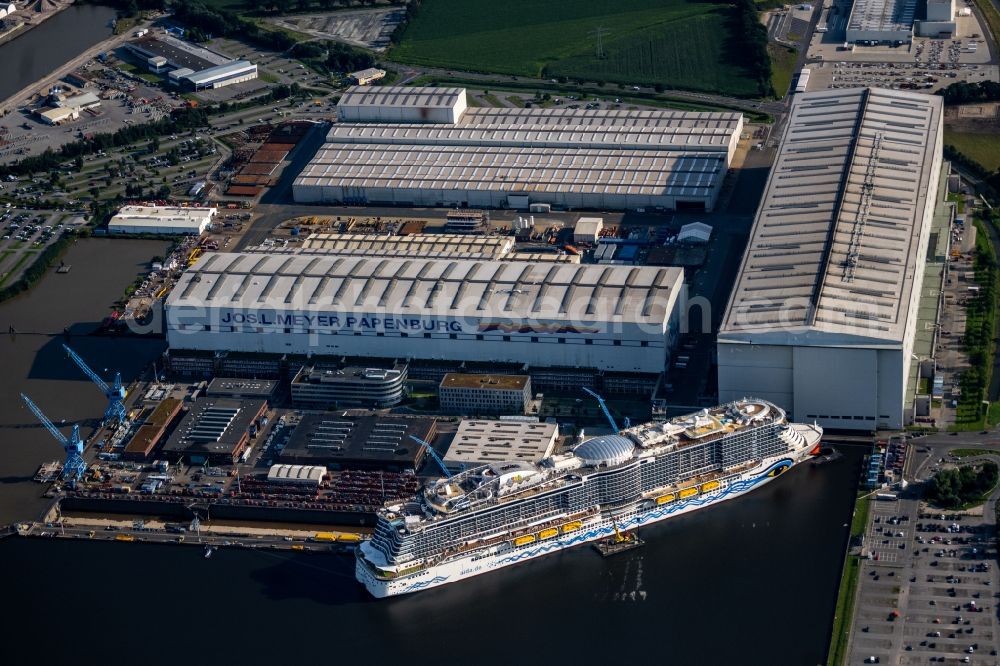 Papenburg from above - Cruise ship AIDAcosma on the shipyard of the Meyer Werft in Papenburg in the state Lower Saxony, Germany