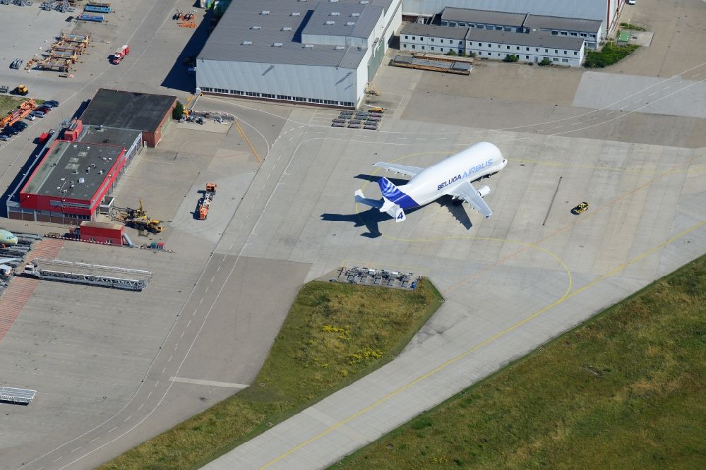 Aerial image Hamburg - The process of discharging an aircraft of the type A300-600ST ( Beluga ) on Hamburg Finkenwerder Airport. Operator of the aircraft is the Airbus Group