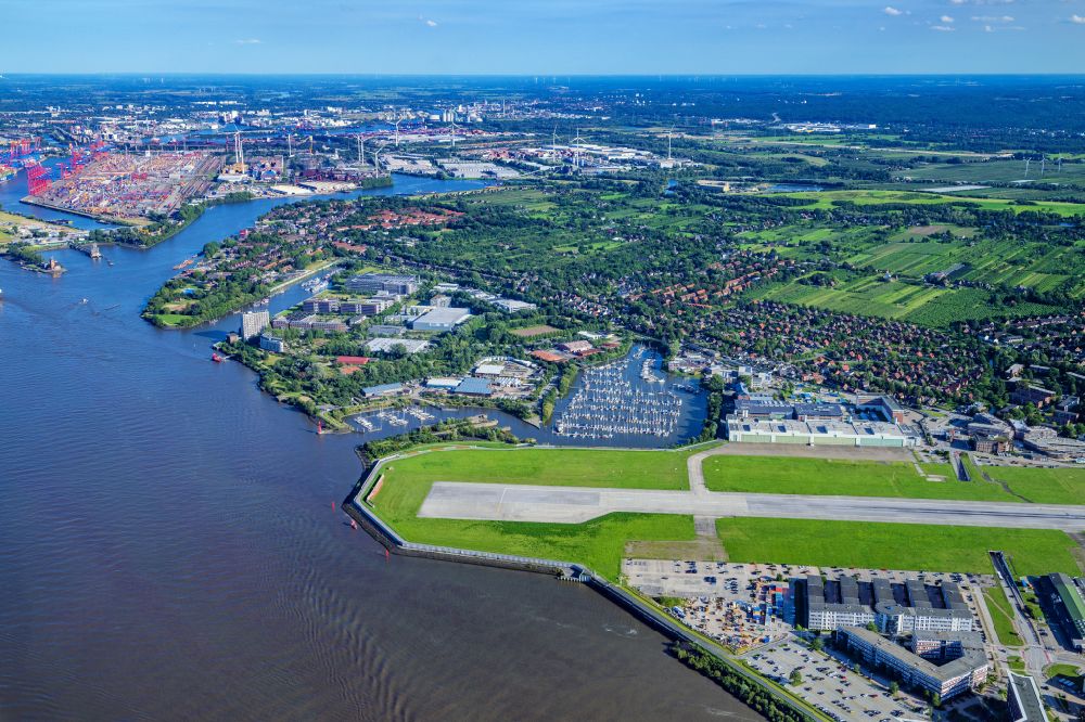 Aerial image Hamburg - Airbus works and airport of Finkenwerder in Hamburg in Germany. The former Hamburger Flugzeugbau works - on the Finkenwerder Peninsula on the riverbank of the Elbe - include an Airbus production site with an airplane. Several Airbus planes and models are being constructed here