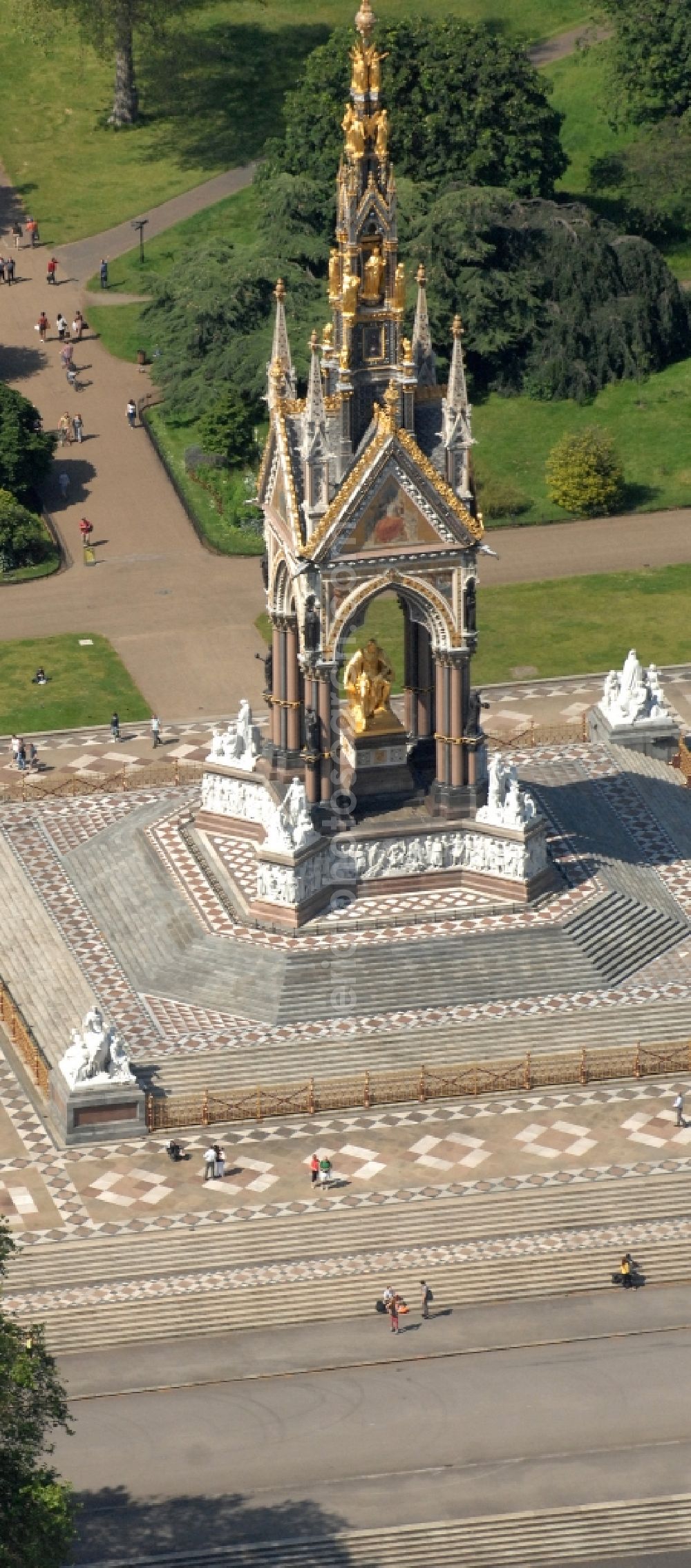 London from the bird's eye view: View of the Albert Memorial in Kensington Gardens in London. The Albert Memorial was commissioned by Queen Victoria of Great Britain and Ireland in memory of Albert of Saxe-Coburg and Gotha in order. It was built by Sir George Gilbert Scott in the years 1864-1875 in the Gothic Revival style