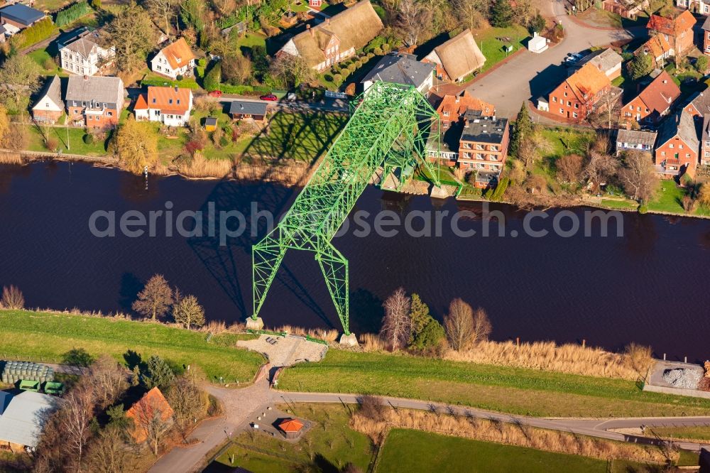Osten from the bird's eye view: Historic Old Bridge of Schwebefaehre about the Oste across in Osten in the state Lower Saxony, Germany