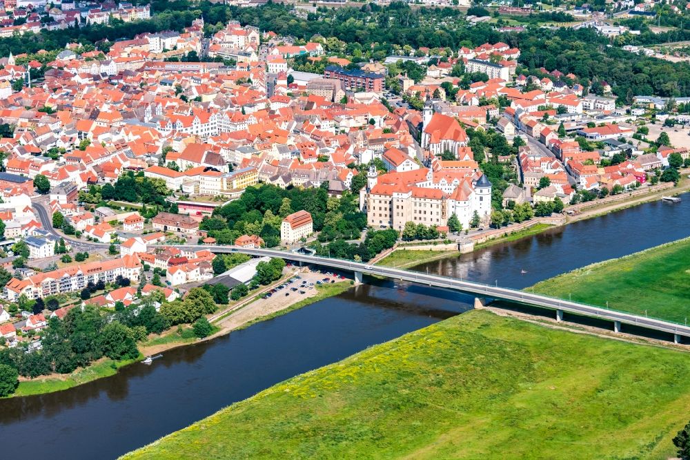 Torgau from above - Old town area and city center as well as Elbe bridge and Hartenfels Castle in Torgau in the state Saxony, Germany