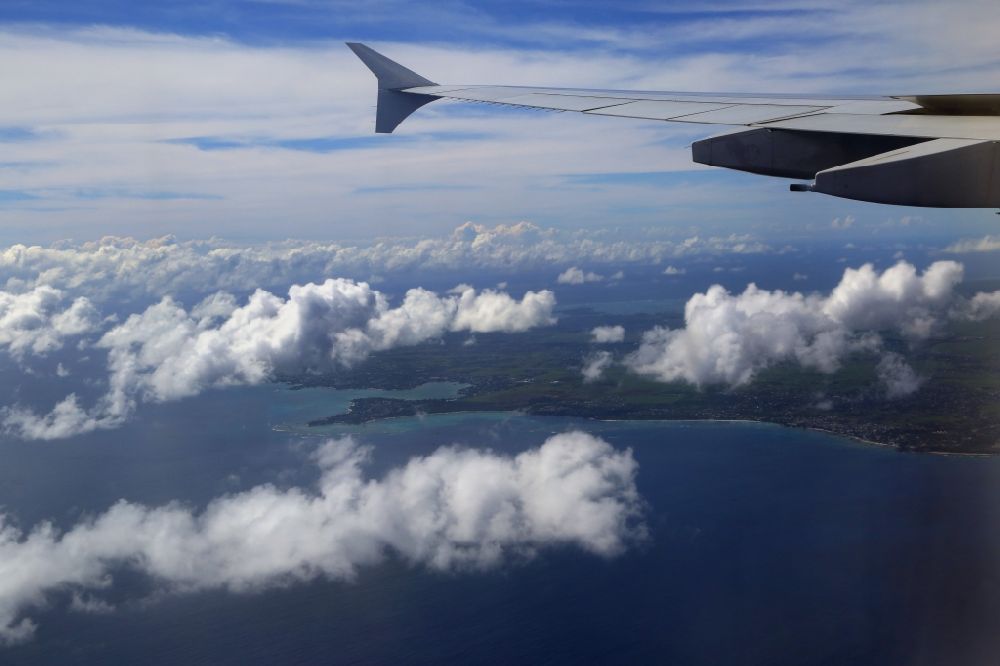 Aerial image Trou-aux-Biches - Indian Ocean. Approaching the holiday island Mauritius with an Airbus A380