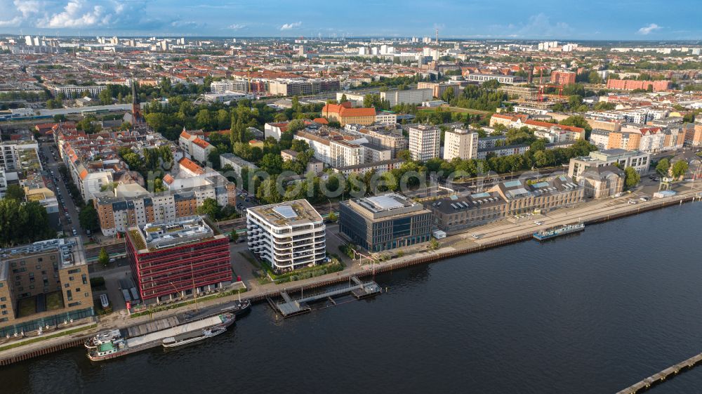 Berlin from above - Construction site of the new multi-family residential and apartment building complex The White on East harbour on the Northern shore of the Spree in Berlin in Germany