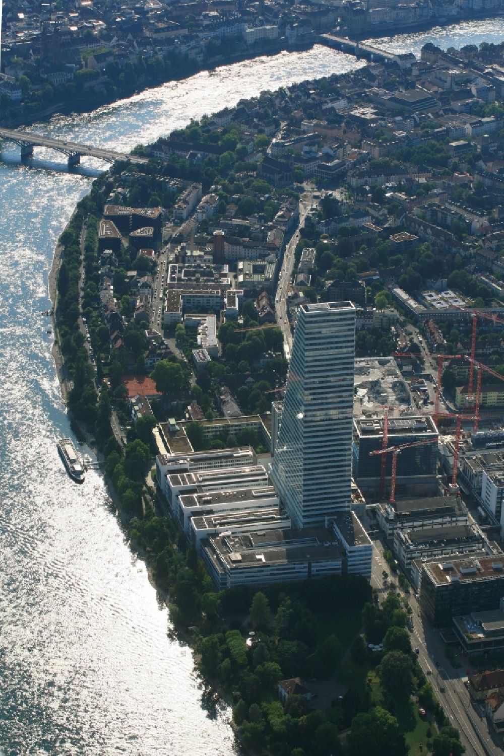 Aerial image Basel - Factory premises of the pharmaceutical company Roche with the landmark building and skyscraper in Basel in Switzerland