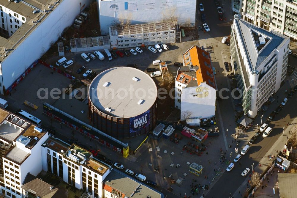 Aerial photograph Berlin - View at the construction site of the new building Asisi-Panometer at the Friedrichstrasse in the district Mitte in Berlin. The Panometer is a project of the artist Yadegar Asisi and shows a panoramic view through an compressed artistic look at his panoramic image The Wall about the divided Berlin during the Cold War. Responsible for the architecture is the architect office Behzadi + Partner Architekten BDA established in Leipzig 