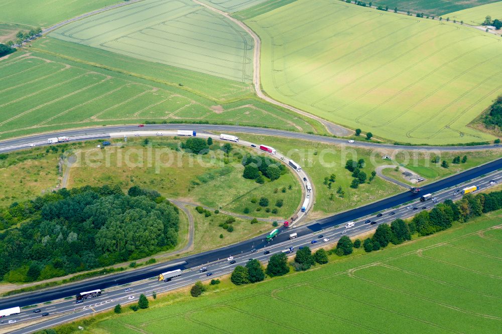Rosdorf from the bird's eye view: Motorway construction site to renew the asphalt surface on the route A7 in Rosdorf in the state Lower Saxony, Germany
