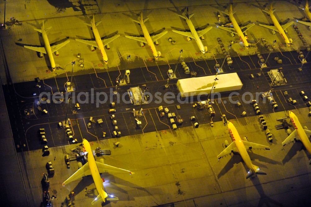 Schkeuditz at night from above - Night lighting check-in buildings and cargo terminals on the grounds of the airport on DHL Hub in Schkeuditz in the state Saxony, Germany