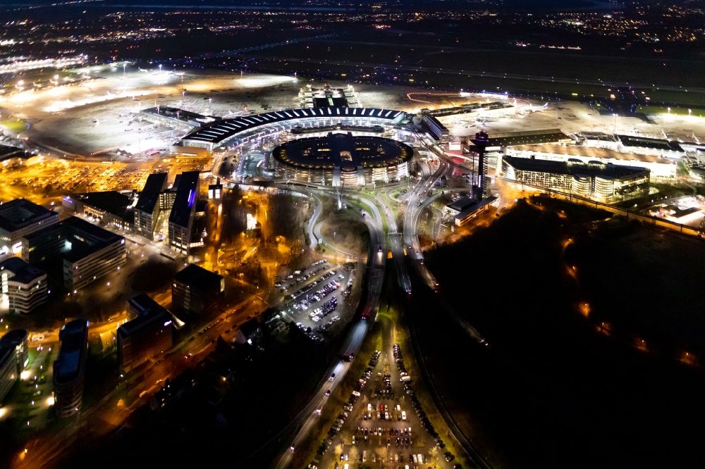 Düsseldorf at night from above - Night lighting dispatch building and terminals on the premises of the airport in Duesseldorf in the state North Rhine-Westphalia, Germany