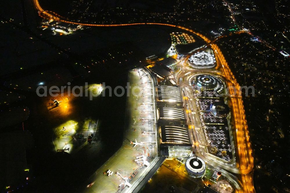 Aerial photograph at night Hamburg - Night lighting dispatch building and terminals on the premises of the airport Hamburg Airport Helmut Schmidt (ICAO-Codea??: a??EDDH) in the district Fuhlsbuettel in Hamburg, Germany