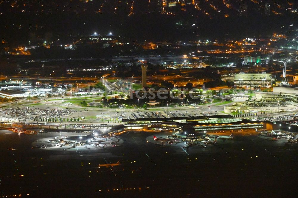 Aerial image at night Newark - Night lighting Dispatch building and terminals on the premises of the airport Newark Liberty International Airport in Newark in New Jersey, United States of America