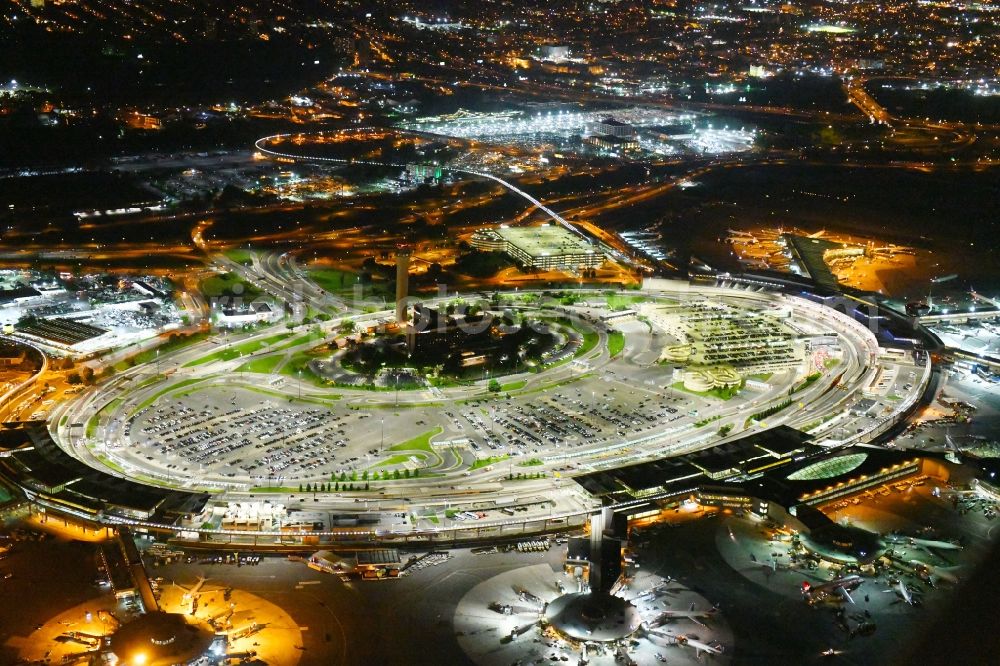 Aerial image at night Newark - Night lighting Dispatch building and terminals on the premises of the airport Newark Liberty International Airport in Newark in New Jersey, United States of America
