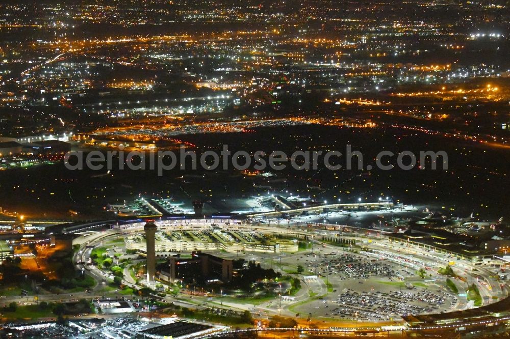 Aerial photograph at night Newark - Night lighting Dispatch building and terminals on the premises of the airport Newark Liberty International Airport in Newark in New Jersey, United States of America