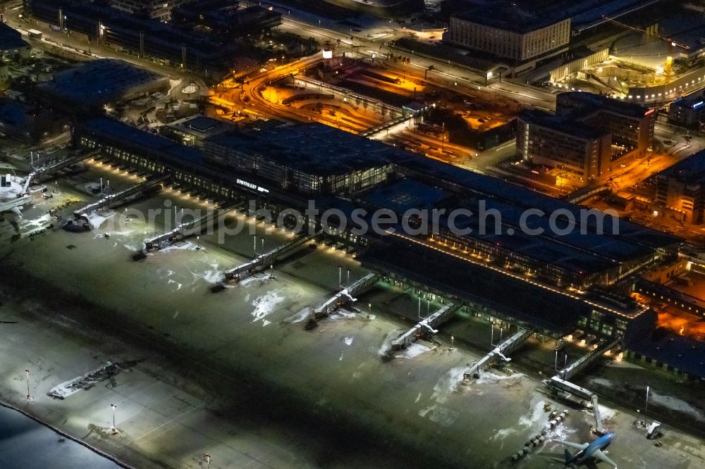 Aerial image at night Stuttgart - Night lighting dispatch building and terminals on the premises of the airport in Stuttgart in the state Baden-Wuerttemberg