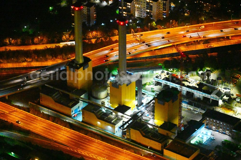 Aerial image at night Berlin - Night lighting demolition and dismantling of the decommissioned power plants and exhaust towers of the cogeneration plant Wilmersdorf Schmargendorf in Berlin, Germany