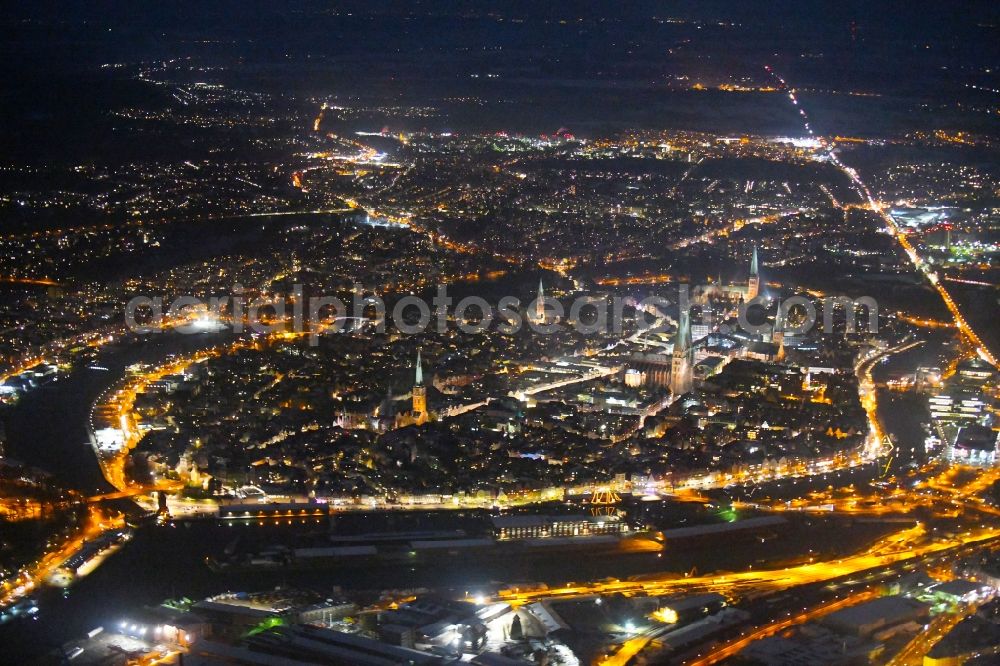 Aerial photograph at night Lübeck - Night lighting old Town area and city center in Luebeck in the state Schleswig-Holstein, Germany