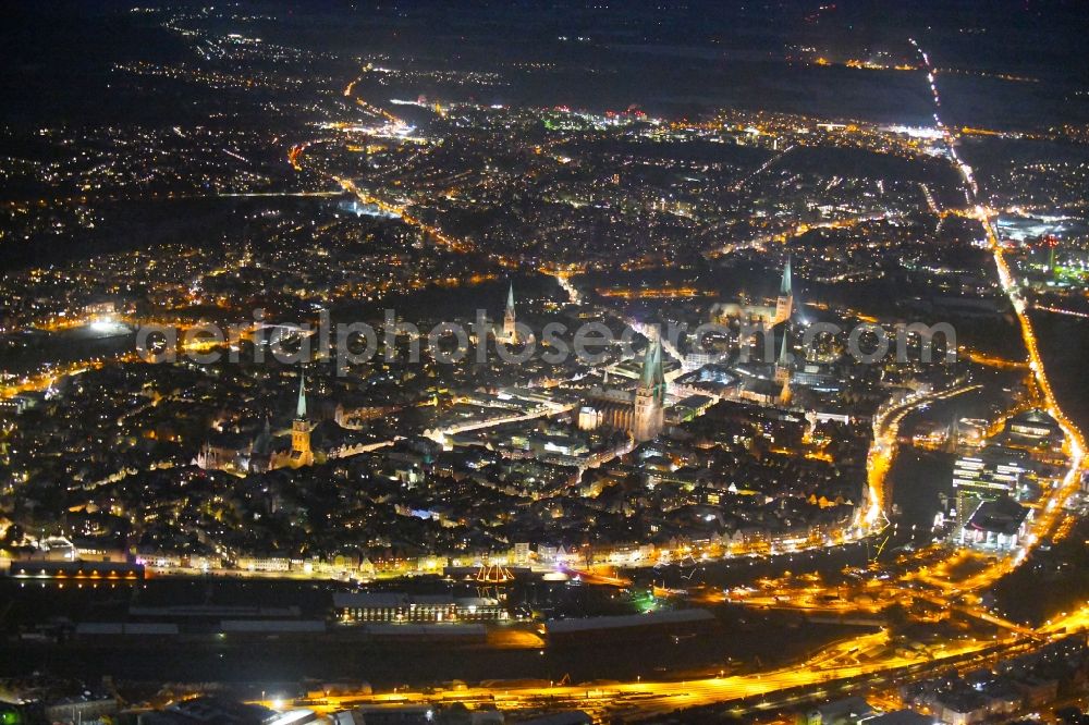 Aerial image at night Lübeck - Night lighting old Town area and city center in Luebeck in the state Schleswig-Holstein, Germany
