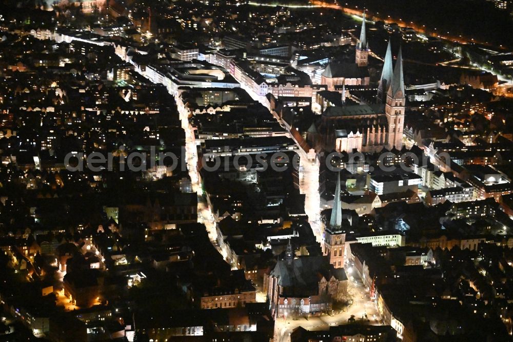 Lübeck at night from the bird perspective: Night lighting old Town area and city center along the Koenigstrasse - Breite Strasse overlooking the local church buildings in the district Altstadt in Luebeck in the state Schleswig-Holstein, Germany