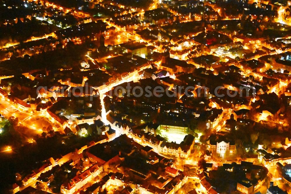 Aerial photograph at night Quedlinburg - Night lighting old Town area and city center in Quedlinburg in the state Saxony-Anhalt, Germany