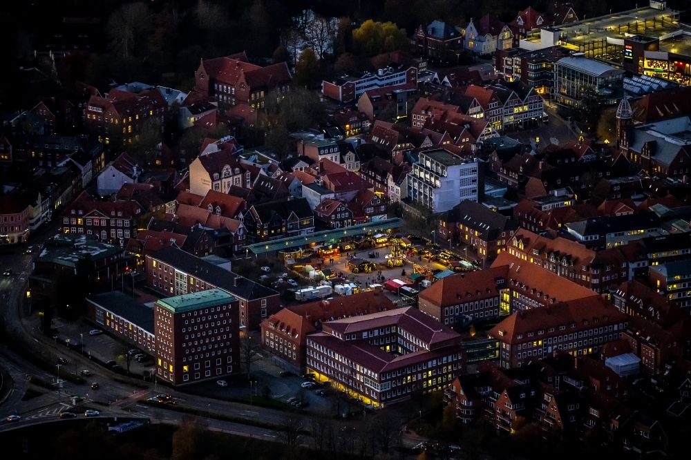 Aerial photograph at night Stade - Night lighting old town area and inner city center Christmas market on the sand in Stade in the state Lower Saxony, Germany