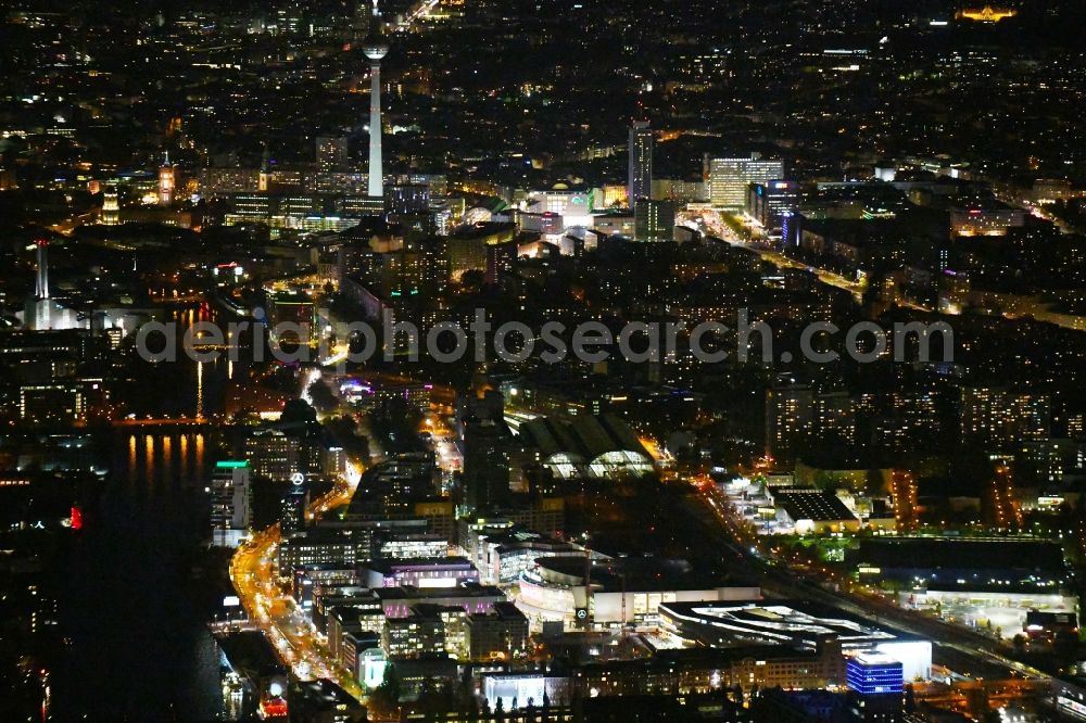 Berlin at night from the bird perspective: Night lighting building on Anschutz- Areal along of Muehlenstrasse in the district Friedrichshain in Berlin, Germany