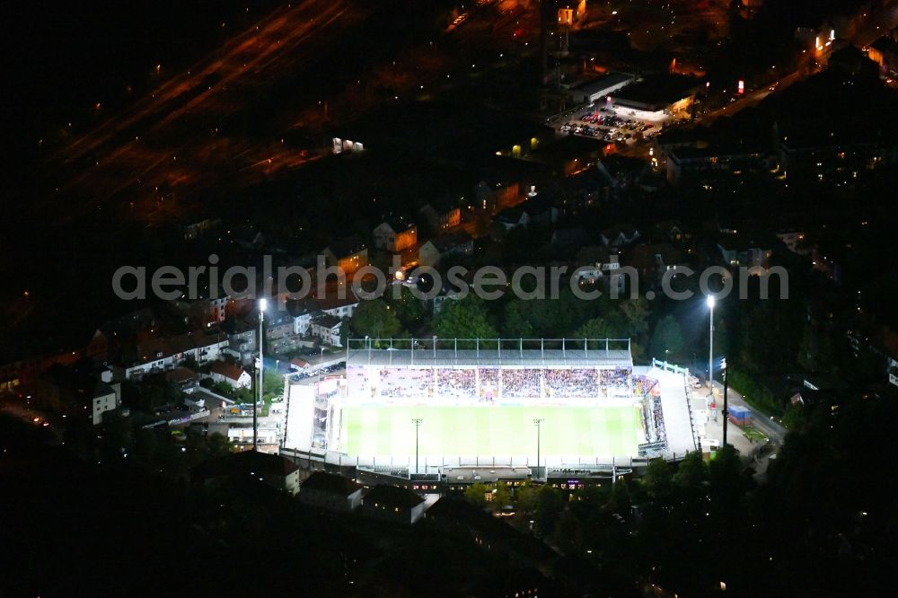 Aerial photograph at night Osnabrück - Night lighting Sports facility grounds of the Arena - stadium in the district Schinkel in Osnabrueck in the state Lower Saxony, Germany