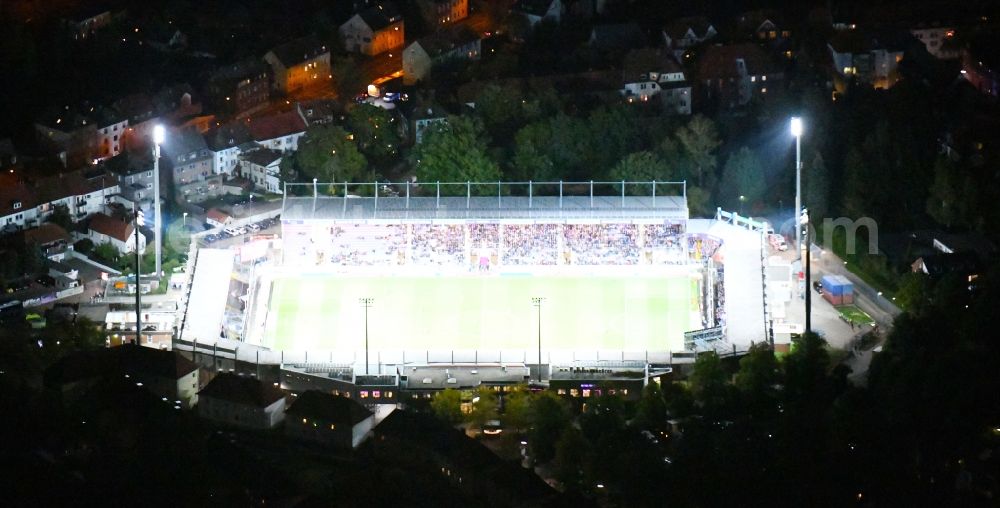 Aerial image at night Osnabrück - Night lighting Sports facility grounds of the Arena - stadium in the district Schinkel in Osnabrueck in the state Lower Saxony, Germany