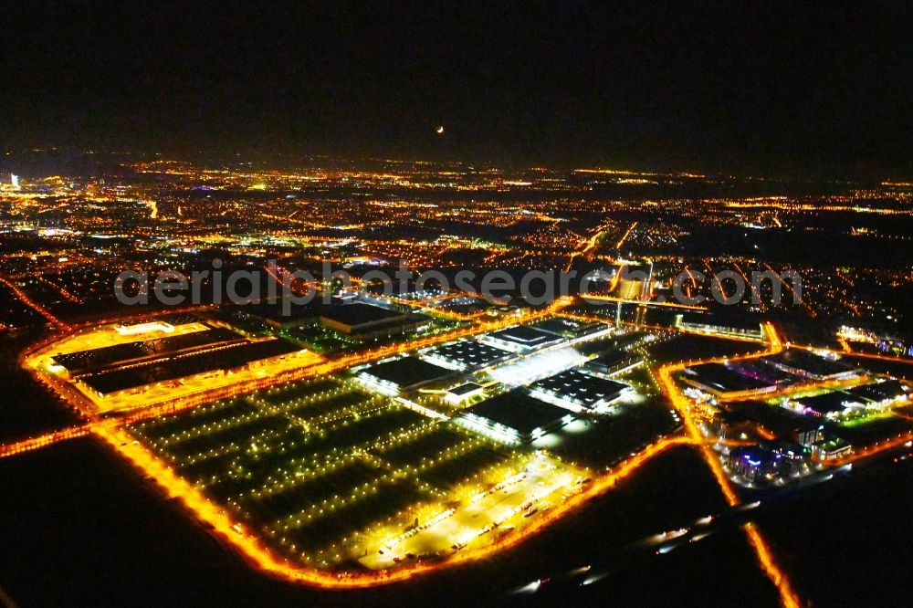 Aerial image at night Leipzig - Night lighting Exhibition grounds and exhibition halls of the LMI - Leipziger Messe International GmbH on Messe-Allee in the district Nord in Leipzig in the state Saxony, Germany