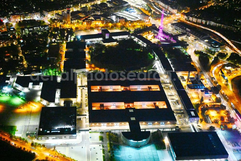 Berlin at night from the bird perspective: Night lighting exhibition grounds and exhibition halls on Messedamm - Kongresszentrum ICC in the district Charlottenburg in Berlin, Germany