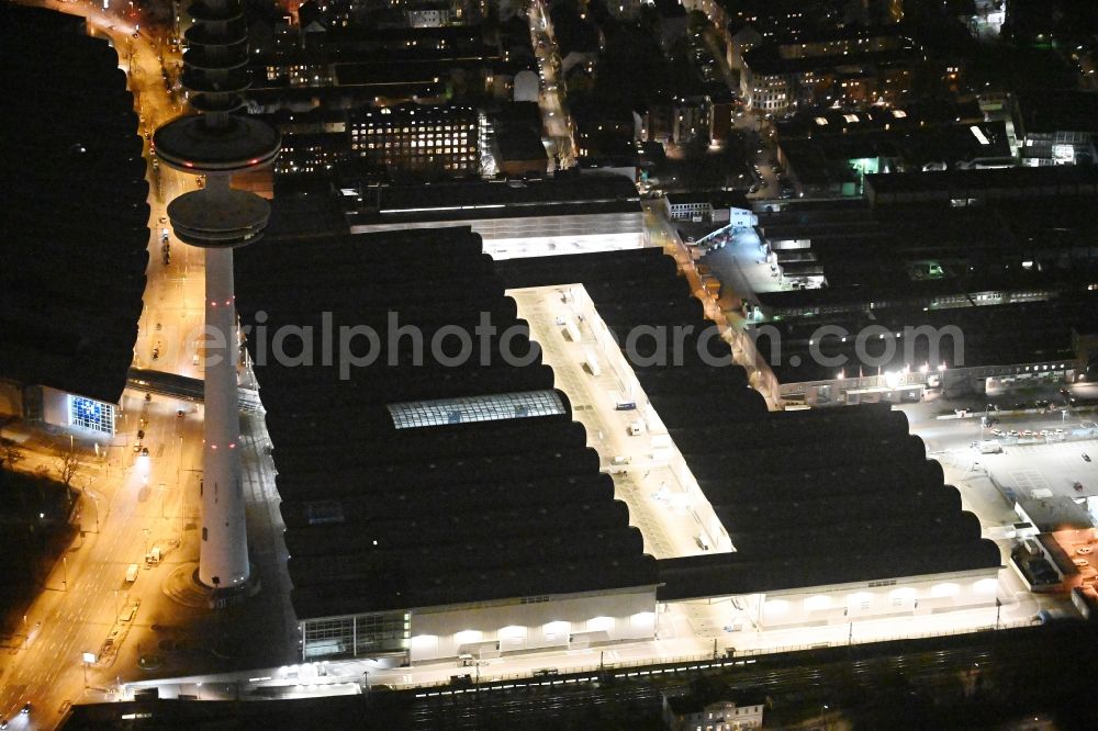 Aerial photograph at night Hamburg - Night lighting exhibition grounds and exhibition halls of the Neue Messe at the broadcasting tower Heinrich-Hertz-Turm in Hamburg, Germany