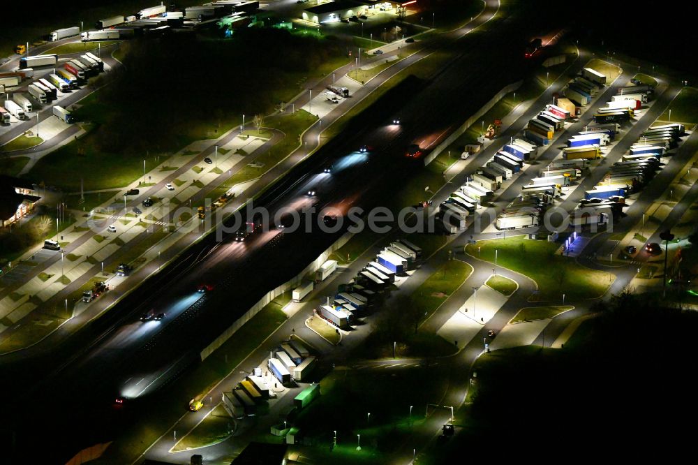 Krauschwitz at night from above - Night lighting routing and traffic lanes during the motorway service station and parking lot of the BAB A 9 - Osterfeld West in Krauschwitz in the state Saxony-Anhalt, Germany