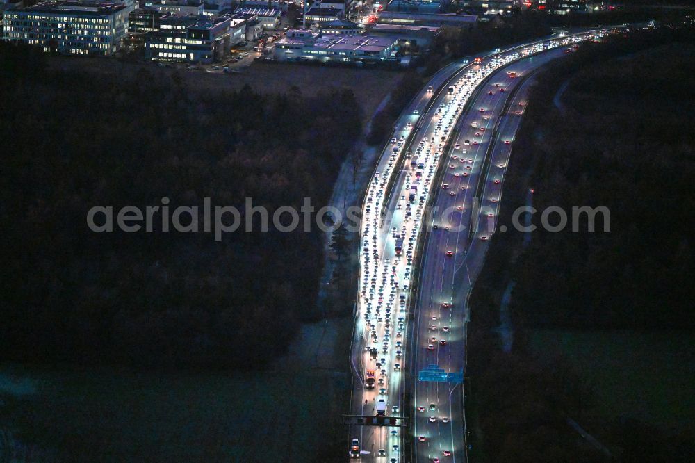 Lochham at night from the bird perspective: Night lighting motorway congestion along the route of the lanes BAB A96 in Lochham in the state Bavaria, Germany