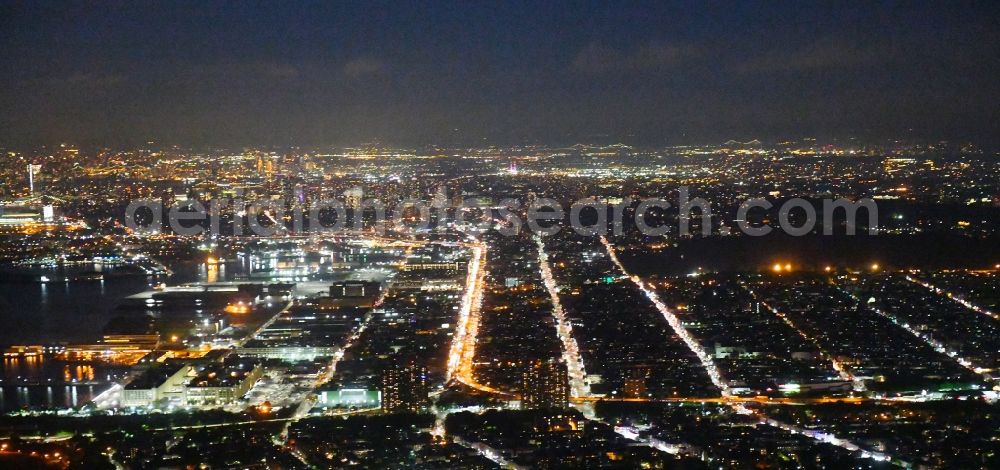 Aerial photograph at night New York - Night lighting Lanes of the motorway- route and course of the Belt Pkwy 278 in the district Brooklyn in New York in United States of America
