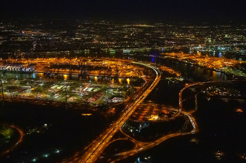 Aerial image at night Hamburg - Night lighting routing and traffic lanes during the highway exit and access the motorway A 7 in the district Altenwerder in Hamburg, Germany