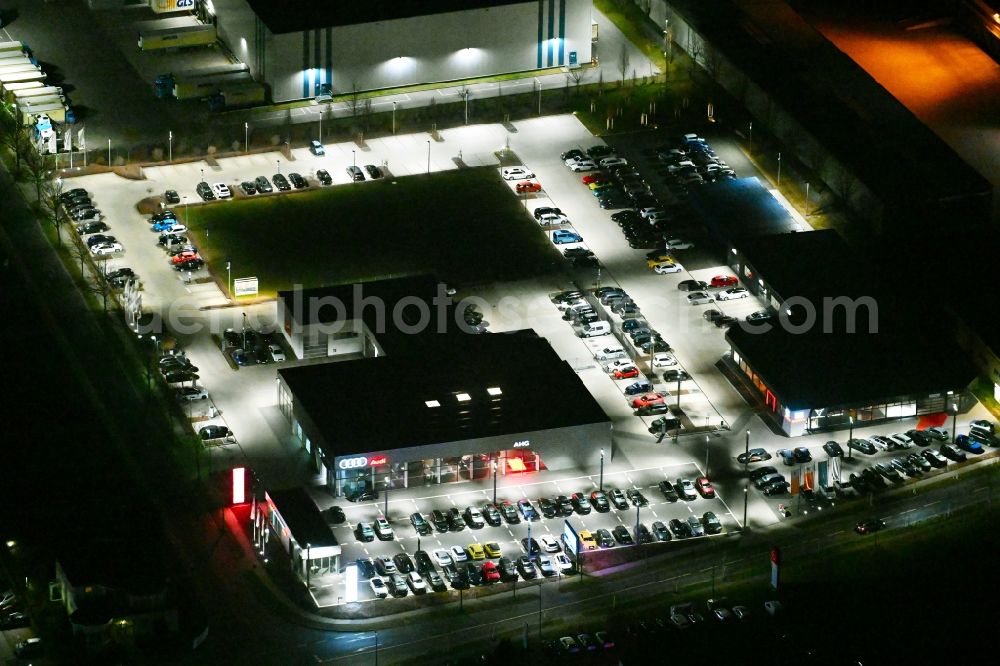 Aerial image at night Gotha - Night lighting car dealership building der AHG Gotha - Audi Partner on Cyrusstrasse in Gotha in the state Thuringia, Germany