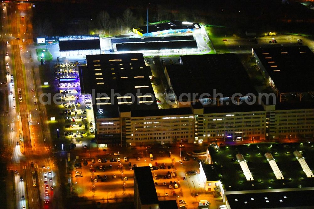 Berlin at night from above - Night lighting car dealership building of Daimler AG on Rhinstrasse in the district Marzahn in Berlin, Germany