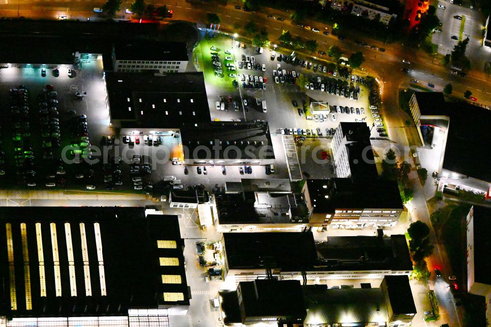 Aerial photograph at night Berlin - Night lighting car dealership building of Volkswagen Automobile Berlin GmbH on Goerzallee in the district Lichterfelde in Berlin, Germany
