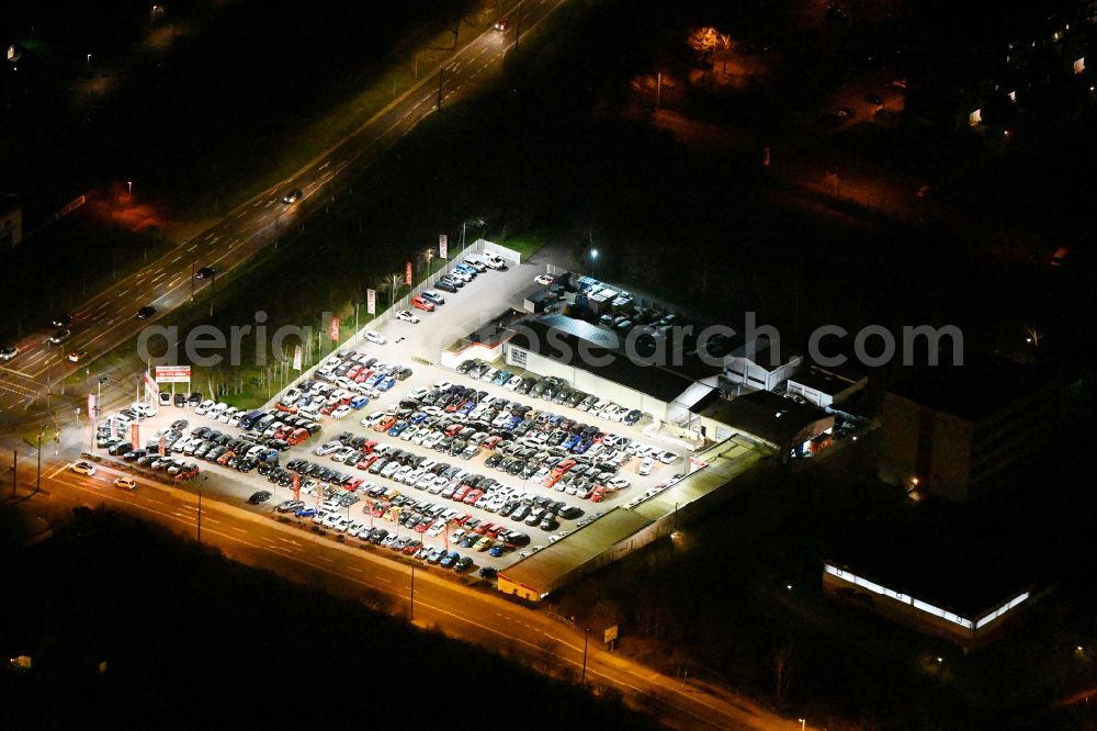 Aerial photograph at night Leipzig - Night lighting vehicle trade building of specialist dealer Autoland AG Niederlassung Leipzig on street Luetzner Strasse in the district Gruenau in Leipzig in the state Saxony, Germany